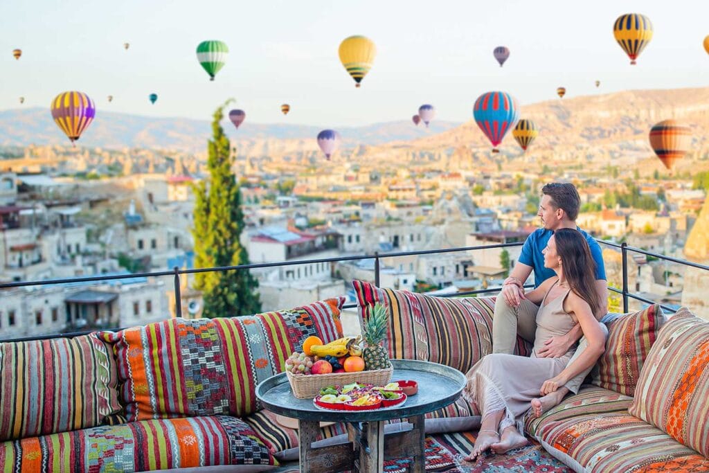 happy young couple during sunrise watching hot air 5TQ6PVE Corporate Accommodation and Houses for Rent